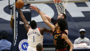 Mar 12, 2021; New Orleans, Louisiana, USA; New Orleans Pelicans forward Zion Williamson (1) shoots the ball against Cleveland Cavaliers center Jarrett Allen (31) and forward Larry Nance Jr. (22) in the first quarter at the Smoothie King Center. Mandatory Credit: Chuck Cook-USA TODAY Sports
