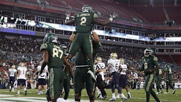 Oct 28, 2016; Tampa, FL, USA; South Florida Bulls running back D'Ernest Johnson (2) celebrates a touchdown with offensive lineman Cameron Ruff (74) in the second half against the Navy Midshipmen at Raymond James Stadium. South Florida Bulls won 52-45. Mandatory Credit: Logan Bowles-USA TODAY Sports