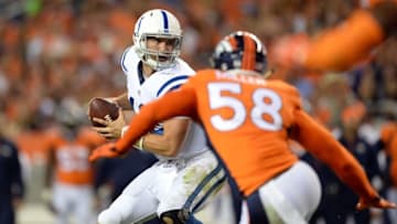 Sep 7, 2014; Denver, CO, USA; Indianapolis Colts quarterback Andrew Luck (12) is hurried by Denver Broncos outside linebacker Von Miller (58) in the third quarter at Sports Authority Field at Mile High. The Broncos defeated the Colts 31-24. Mandatory Credit: Ron Chenoy-USA TODAY Sports