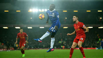 Chelsea's French midfielder N'Golo Kante (C) controls the ball during the English Premier League football match between Liverpool and Chelsea at Anfield in Liverpool, north west England on January 31, 2017.The match ended in a draw at 1-1. / AFP / Paul ELLIS / RESTRICTED TO EDITORIAL USE. No use with unauthorized audio, video, data, fixture lists, club/league logos or 'live' services. Online in-match use limited to 75 images, no video emulation. No use in betting, games or single club/league/player publications. / (Photo credit should read PAUL ELLIS/AFP/Getty Images)