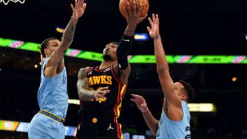 MEMPHIS, TENNESSEE - NOVEMBER 26: Cam Reddish #22 of the Atlanta Hawks goes to the basket against Brandon Clarke #15 of the Memphis Grizzlies during the first half at FedExForum on November 26, 2021 in Memphis, Tennessee. NOTE TO USER: User expressly acknowledges and agrees that, by downloading and or using this photograph, User is consenting to the terms and conditions of the Getty Images License Agreement. (Photo by Justin Ford/Getty Images)