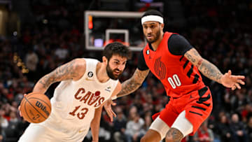 PORTLAND, OREGON - JANUARY 12: Ricky Rubio #13 of the Cleveland Cavaliers drives against Gary Payton II #00 of the Portland Trail Blazers during the third quarter at the Moda Center on January 12, 2023 in Portland, Oregon. The Cleveland Cavaliers won 119-113. NOTE TO USER: User expressly acknowledges and agrees that, by downloading and or using this photograph, User is consenting to the terms and conditions of the Getty Images License Agreement. (Photo by Alika Jenner/Getty Images)