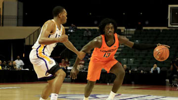 ORLANDO, FLORIDA - NOVEMBER 25: Isaac Likekele #13 of the Oklahoma State Cowboys looks to make a pass during the game against the LSU Tigers at HP Field House on November 25, 2018 in Orlando, Florida. (Photo by Sam Greenwood/Getty Images)
