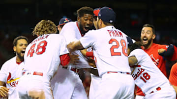 ST. LOUIS, MO - MAY 6: Dexter Fowler #25 of the St. Louis Cardinals is mobbed by his teammates after hitting a walk-off two-run home run in the fourteenth inning at Busch Stadium on May 6, 2018 in St. Louis, Missouri. (Photo by Dilip Vishwanat/Getty Images)