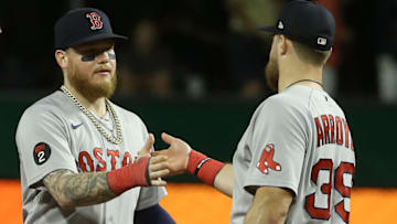 Aug 17, 2022; Pittsburgh, Pennsylvania, USA; Boston Red Sox right fielder Alex Verdugo (left) and second baseman Christian Arroyo (39) celebrate after defeating the Pittsburgh Pirates at PNC Park. Mandatory Credit: Charles LeClaire-USA TODAY Sports