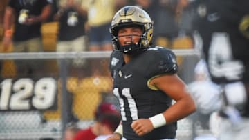 ORLANDO, FLORIDA - SEPTEMBER 14: Dillon Gabriel #11 of the UCF Knights runs off the field after throwing a 1-yard touchdown pass in the fourth quarter of a football game against the Stanford Cardinals at Spectrum Stadium on September 14, 2019 in Orlando, Florida. (Photo by Julio Aguilar/Getty Images)