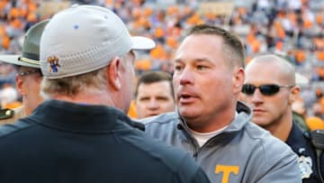 Nov 12, 2016; Knoxville, TN, USA; Tennessee Volunteers head coach Butch Jones and Kentucky Wildcats head coach Mark Stoops meet after the game at Neyland Stadium. Tennessee won 49 to 36. Mandatory Credit: Randy Sartin-USA TODAY Sports