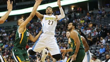 Nov 20, 2016; Denver, CO, USA; Denver Nuggets guard Jamal Murray (27) shoots the ball against Utah Jazz guard Dante Exum (11) during the second half at Pepsi Center. The Nuggets won 105-91. Mandatory Credit: Chris Humphreys-USA TODAY Sports