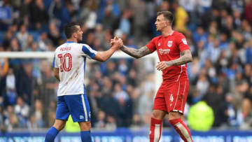 BRIGHTON, ENGLAND - APRIL 29: Tomer Hemed of Brighton and Hove Albion shakes hands with Aden Flint of Bristol City after the Sky Bet Championship match between Brighton