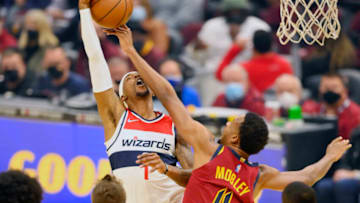 Nov 10, 2021; Cleveland, Ohio, USA; Cleveland Cavaliers center Evan Mobley (4) defends Washington Wizards guard Kentavious Caldwell-Pope (1) in the first quarter at Rocket Mortgage FieldHouse. Mandatory Credit: David Richard-USA TODAY Sports