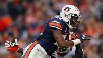 AUBURN, AL - NOVEMBER 11: Kerryon Johnson #21 of the Auburn Tigers rushes against Tyler Clark #52 of the Georgia Bulldogs at Jordan Hare Stadium on November 11, 2017 in Auburn, Alabama. (Photo by Kevin C. Cox/Getty Images)
