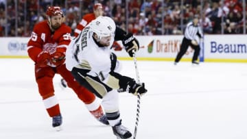 Mar 26, 2016; Detroit, MI, USA; Pittsburgh Penguins right wing Phil Kessel (81) takes a shot in the second period against the Detroit Red Wings at Joe Louis Arena. Mandatory Credit: Rick Osentoski-USA TODAY Sports