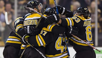 Oct 20, 2016; Boston, MA, USA; Boston Bruins center Patrice Bergeron (37) is mobbed by teammates including left wing Brad Marchand (63) after scoring the winning goal during the third period of the Boston Bruins 2-1 win over the New Jersey Devils at TD Garden. Mandatory Credit: Winslow Townson-USA TODAY Sports
