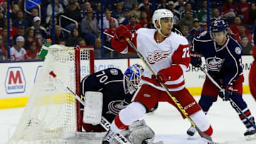 Mar 8, 2016; Columbus, OH, USA; Detroit Red Wings center Andreas Athanasiou (72) scores on a deflection against Columbus Blue Jackets goalie Joonas Korpisalo (70) during the third period at Nationwide Arena. Columbus defeated Detroit 5-3. Mandatory Credit: Russell LaBounty-USA TODAY Sports
