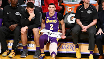 LOS ANGELES, CA - MARCH 28: Lonzo Ball #2 of the Los Angeles Lakers ices a sore knee during the second half of a basketball game against the Dallas Mavericks at Staples Center on March 28, 2018 in Los Angeles, California. NOTE TO USER: User expressly acknowledges and agrees that, by downloading and or using this photograph, User is consenting to the terms and conditions of the Getty Images License Agreement. (Photo by Allen Berezovsky/Getty Images)