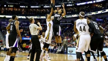 Mar 27, 2015; New Orleans, LA, USA; Sacramento Kings guard Ray McCallum (3) beats New Orleans Pelicans center Alexis Ajinca (42) on a jump ball during the fourth quarter of a game at the Smoothie King Center. The Pelicans defeated the Kings 102-88. Mandatory Credit: Derick E. Hingle-USA TODAY Sports