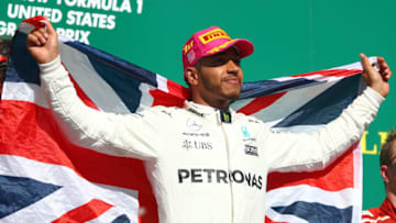 AUSTIN, TX - OCTOBER 22: Race winner Lewis Hamilton of Great Britain and Mercedes GP celebrates on the podium during the United States Formula One Grand Prix at Circuit of The Americas on October 22, 2017 in Austin, Texas. (Photo by Clive Rose/Getty Images)