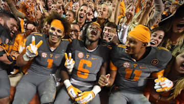 Tennessee players Jalen Hurd, left, Alvin Kamara, and Joshua Dobbs celebrate following the Vols' 38-31 win over Georgia Saturday, Oct. 10, 2015, at Neyland Stadium. Utvsugathroughtheyears28