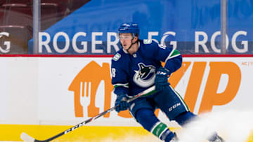 VANCOUVER, BC - JANUARY 20: Jake Virtanen #18 of the Vancouver Canucks skates with the puck during NHL hockey action against the Montreal Canadiens at Rogers Arena on January 20, 2021 in Vancouver, Canada. (Photo by Rich Lam/Getty Images)
