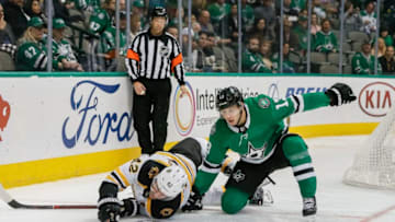 DALLAS, TX - NOVEMBER 16: Boston Bruins right wing David Backes (42) and Dallas Stars center Mattias Janmark (13) battle for the puck behind the net during the game between the Dallas Stars and the Boston Bruins on November 16, 2018 at the American Airlines Center in Dallas, Texas. (Photo by Matthew Pearce/Icon Sportswire via Getty Images)