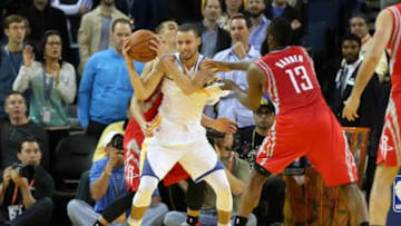 Feb 20, 2014; Oakland, CA, USA; Houston Rockets point guard Jeremy Lin (7) and w13#2 combine to foul Golden State Warriors point guard Stephen Curry (30) during the overtime period at Oracle Arena. The Golden State Warriors defeated the Houston Rockets 102-99 in overtime. Mandatory Credit: Kelley L Cox-USA TODAY Sports