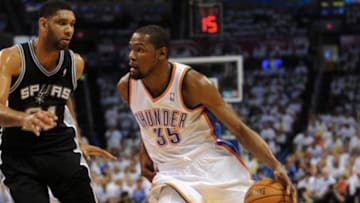 May 31, 2014; Oklahoma City, OK, USA; Oklahoma City Thunder forward Kevin Durant (35) drives to the basket against San Antonio Spurs forward Tim Duncan (21) during the first quarter in game six of the Western Conference Finals of the 2014 NBA Playoffs at Chesapeake Energy Arena. Mandatory Credit: Mark D. Smith-USA TODAY Sports