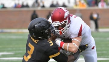 Nov 25, 2016; Columbia, MO, USA; Arkansas Razorbacks wide receiver Drew Morgan (80) runs the ball and is tackled by Missouri Tigers safety Ronnell Perkins (3) during the first half at Faurot Field. Mandatory Credit: Denny Medley-USA TODAY Sports