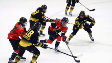 BOSTON, MASSACHUSETTS - MARCH 26: Mikyla Grant-Mentis #13 of Toronto Six skates against Taylor Wenczkowski #18 and Paige Capistran #20 of Boston Pride during first period of the NWHL Isobel Cup Semifinal at Warrior Ice Arena on March 26, 2021 in Boston, Massachusetts. (Photo by Maddie Meyer/Getty Images)