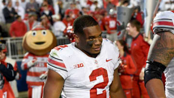 STATE COLLEGE, PA - SEPTEMBER 29: Ohio State RB J.K. Dobbins (2) leaves the field after the game with their mascot Brutus the Buckeye behind him. The Ohio State Buckeyes defeated the Penn State Nittany Lions 27-26 on September 29, 2018 at Beaver Stadium in State College, PA. (Photo by Randy Litzinger/Icon Sportswire via Getty Images)