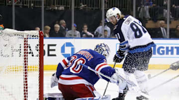 NEW YORK, NEW YORK - OCTOBER 03: Henrik Lundqvist #30 makes the third period stop on Kyle Connor #81 of the Winnipeg Jets at Madison Square Garden on October 03, 2019 in New York City. The Rangers defeated the Jets 6-4. (Photo by Bruce Bennett/Getty Images)