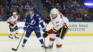 Nov 12, 2015; Tampa, FL, USA; Calgary Flames defenseman T.J. Brodie (7) shoots against the Tampa Bay Lightning during the first period at Amalie Arena. Mandatory Credit: Kim Klement-USA TODAY Sports