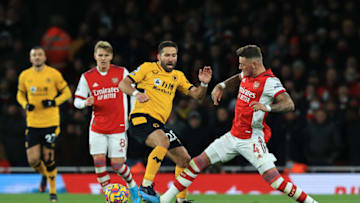 LONDON, ENGLAND - FEBRUARY 24: Joao Moutinho of Wolverhampton Wanderers is tackled by Ben White of Arsenal during the Premier League match between Arsenal and Wolverhampton Wanderers at Emirates Stadium on February 24, 2022 in London, England. (Photo by David Rogers/Getty Images)