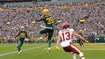 GREEN BAY, WISCONSIN - OCTOBER 24: Chandon Sullivan #39 of the Green Bay Packers intercepts a pass intended for Adam Humphries #13 of the Washington Football Team during a game at Lambeau Field on October 24, 2021 in Green Bay, Wisconsin. (Photo by Stacy Revere/Getty Images)