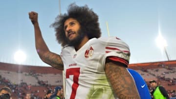 Dec 24, 2016; Los Angeles, CA, USA; San Francisco 49ers quarterback Colin Kaepernick (7) pumps his fist as he acknowledges the cheers from the 49ers' fans after leading his team to a 22-21 come-from-behind win over the Los Angeles Rams at Los Angeles Memorial Coliseum. Mandatory Credit: Robert Hanashiro-USA TODAY Sports