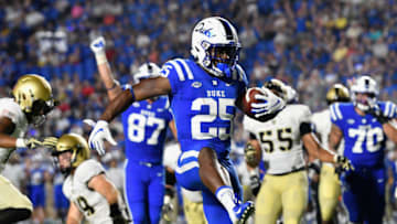 DURHAM, NC - AUGUST 31: Deon Jackson #25 of the Duke Blue Devils high-steps into the end zone for a touchdown during their game against the Army Black Knights at Wallace Wade Stadium on August 31, 2018 in Durham, North Carolina. Duke won 34-14. (Photo by Grant Halverson/Getty Images)
