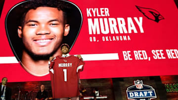 Kyler Murray poses with his new jersey after being picked first by the Arizona Cardinals during the first round of the NFL Draft Thursday, April 25, 2019, in Nashville, Tenn.Gw41345