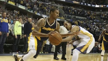 Feb 22, 2015; Indianapolis, IN, USA; Indiana Pacers guard George Hill (3) drives to the basket against Golden State Warriors guard Shaun Livingston (34) at Bankers Life Fieldhouse. Indiana defeats Golden State 104-98. Mandatory Credit: Brian Spurlock-USA TODAY Sports