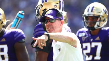 SEATTLE, WASHINGTON - AUGUST 31: Head Coach Chris Petersen of the Washington Huskies signals to team members in the first quarter against the Eastern Washington Eagles during their game at Husky Stadium on August 31, 2019 in Seattle, Washington. (Photo by Abbie Parr/Getty Images)