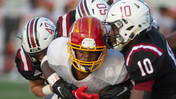 Lake Charles' Trevon Citizen (12) fights to push through Mavericks Andrew Dinkelacker (47), Monterrius Walker (50) and Dakota Haralson (10) during play at Germantown Friday, Sept. 3, 2021.Tcl Germantown Lake Charles