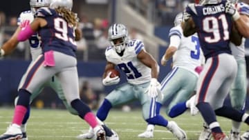 Oct 11, 2015; Arlington, TX, USA; Dallas Cowboys running back Joseph Randle (21) runs with the ball against the New England Patriots at AT&T Stadium. Mandatory Credit: Matthew Emmons-USA TODAY Sports