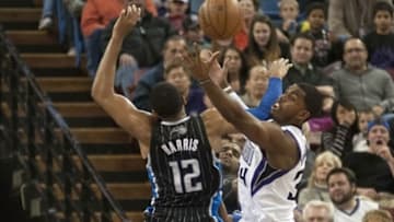 Jan 10, 2014; Sacramento, CA, USA; Orlando Magic small forward Tobias Harris (12) and Sacramento Kings power forward Jason Thompson (34) fight for the rebound during the second quarter at Sleep Train Arena. Mandatory Credit: Ed Szczepanski-USA TODAY Sports