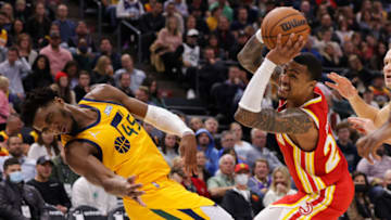 Nov 9, 2021; Salt Lake City, Utah, USA; Atlanta Hawks forward John Collins (20) hits Utah Jazz guard Donovan Mitchell (45) with his elbow during the second quarter at Vivint Arena. Mandatory Credit: Chris Nicoll-USA TODAY Sports