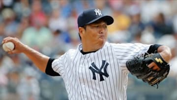 Sep 8, 2013; Bronx, NY, USA; New York Yankees starting pitcher Hiroki Kuroda (18) patches during the first inning against the Boston Red Sox at Yankee Stadium. Mandatory Credit: Anthony Gruppuso-USA TODAY Sports