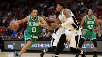 MIAMI, FL - DECEMBER 18: Avery Bradley #0 of the Boston Celtics in action against Hassan Whiteside #21 of the Miami Heat during the game at the American Airlines Arena on December 18, 2016 in Miami, Florida. NOTE TO USER: User expressly acknowledges and agrees that, by downloading and or using this photograph, User is consenting to the terms and conditions of the Getty Images License Agreement.Ê(Photo by Rob Foldy/Getty Images)