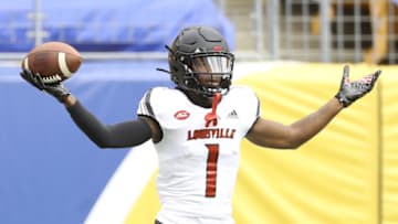 Sep 26, 2020; Pittsburgh, Pennsylvania, USA; Louisville Cardinals wide receiver Tutu Atwell (1) celebrates his touchdown against the Pittsburgh Panthers during the second quarter at Heinz Field. Mandatory Credit: Charles LeClaire-USA TODAY Sports
