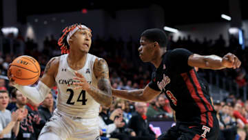 Cincinnati Bearcats guard Jeremiah Davenport controls ball against Temple Owls at Fifth Third Arena. USA Today.