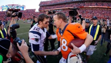 DENVER, CO - JANUARY 19: Tom Brady #12 of the New England Patriots congratulates Peyton Manning #18 of the Denver Broncos after the Broncos defeated the Patriots 26 to 16 during the AFC Championship game at Sports Authority Field at Mile High on January 19, 2014 in Denver, Colorado. (Photo by Kevin C. Cox/Getty Images)