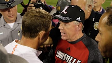 CLEMSON, SC - OCTOBER 01: Head coach Dabo Swinney of the Clemson Tigers and head coach Bobby Petrino of the Louisville Cardinals meet at mid-field after the Clemson Tigers victory at Memorial Stadium on October 1, 2016 in Clemson, South Carolina. The Clemson Tigers defeated the Louisville Cardinals 42-36. (Photo by Tyler Smith/Getty Images)
