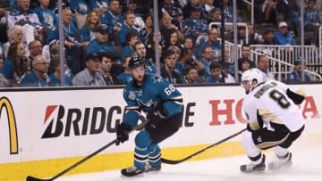 Jun 4, 2016; San Jose, CA, USA; San Jose Sharks right wing Melker Karlsson (68) controls the puck against Pittsburgh Penguins defenseman Brian Dumoulin (8) in the first period of game three of the 2016 Stanley Cup Final at SAP Center at San Jose. Mandatory Credit: Kyle Terada-USA TODAY Sports