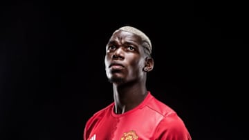 MANCHESTER, ENGLAND - AUGUST 08: (MINIMUM FEES APPLY - MINIMUM PRINT/BROADCAST FEE OF 150 GBP, ONLINE FEE OF 75 GBP, OR LOCAL EQUIVALENT) (EXCLUSIVE COVERAGE) Paul Pogba of Manchester United poses after signing for the club at Aon Training Complex on August 8, 2016 in Manchester, England. (Photo by Man Utd via Getty Images)
